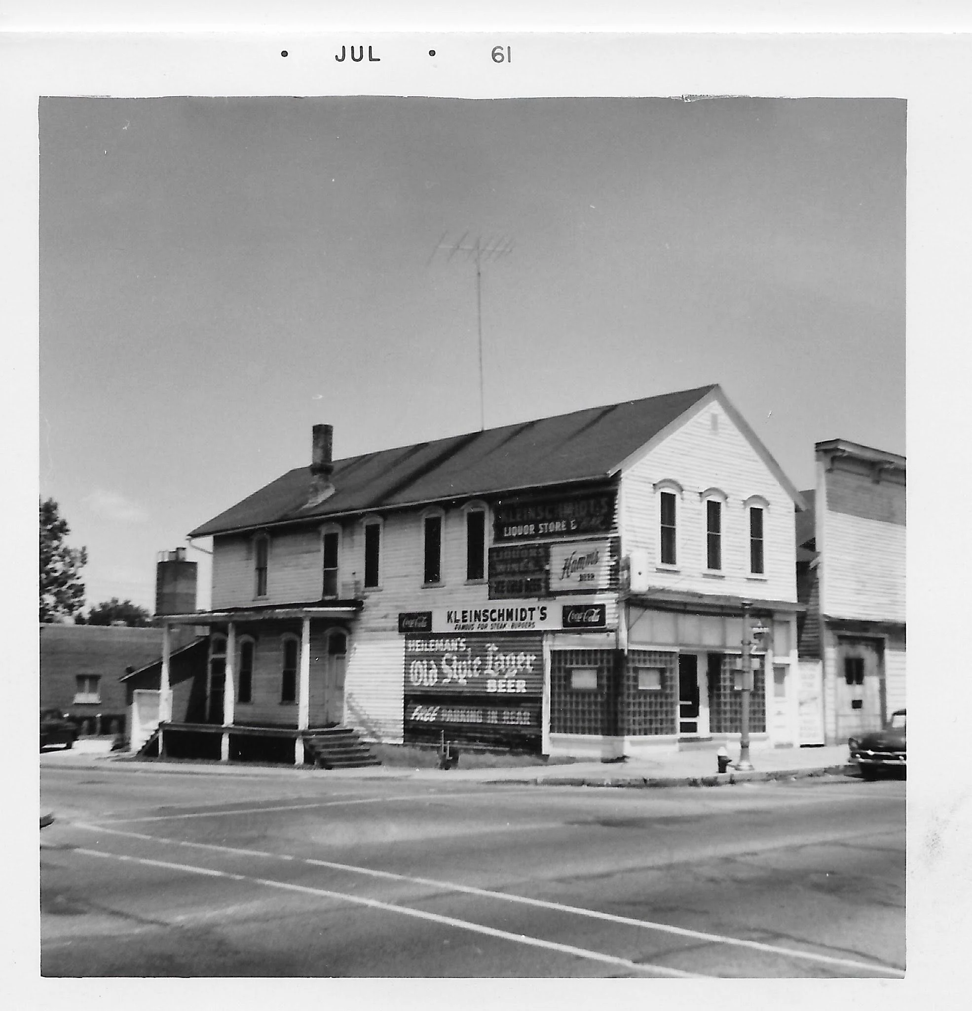 Kleinschmidt's Liquor Store and steak/burger restaurant, corner building, dated July 1961