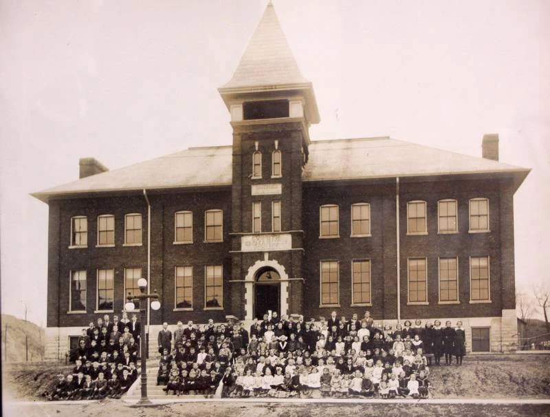 Immanuel Lutheran School class photograph, students and staff on the front steps