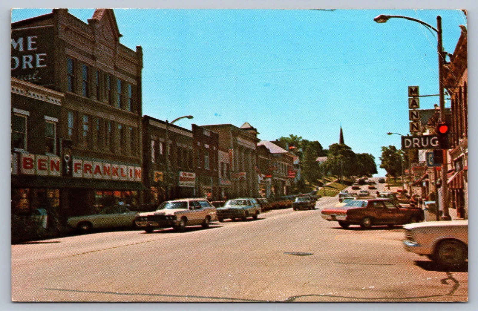Main St. West, Dundee, Ill. — Ben Franklin 5&10, Bond Drugs, 1960s–70s color postcard