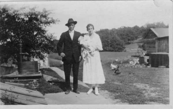Zierk family farm, Dundee, Illinois, 1920 — man, woman, and infant on a farm path, chickens visible